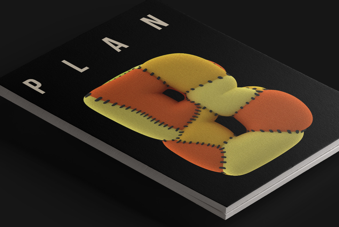 Black book cover with a padded Toy Font monogram in orange and yellow patches