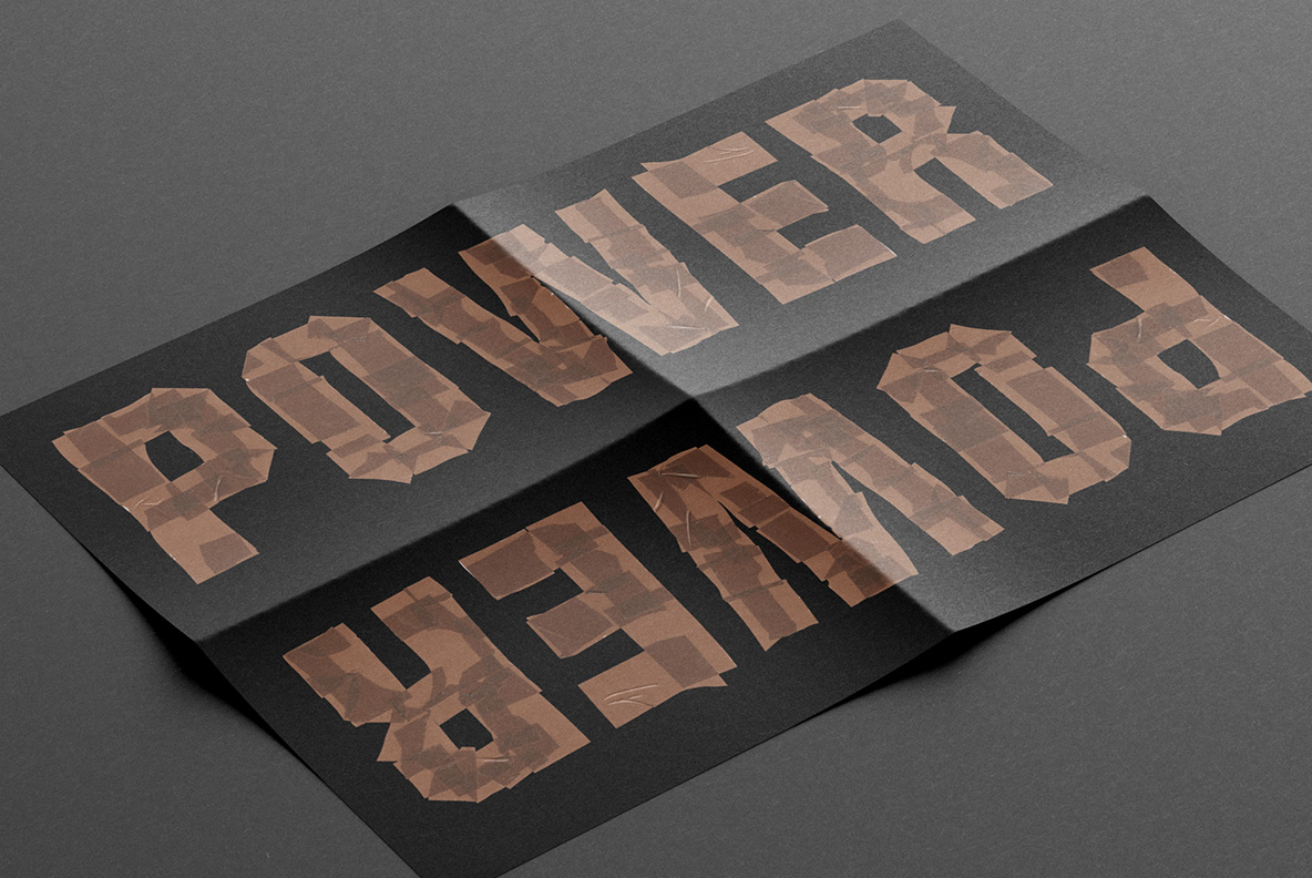 Brown Tape Font On Black Flyers Two black flyers with a mirrored word set in the Brown Tape Font.