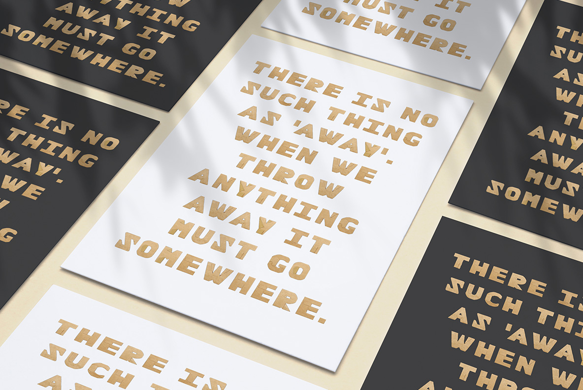 Several printed posters with body text and headings in the Cardboard Cut Font