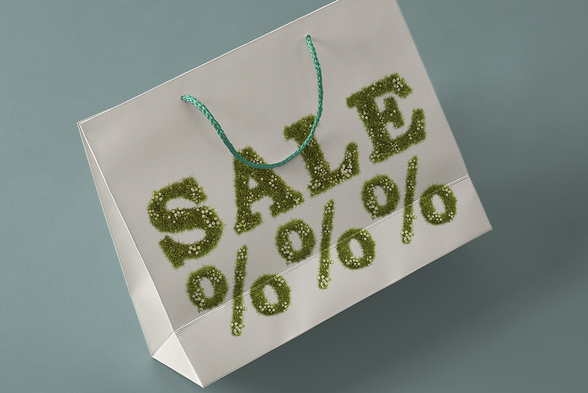 Paper shopping bag printed with the word sale in the Daisy Font