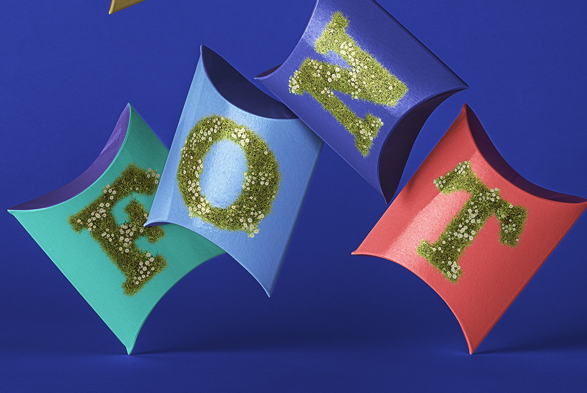 Coloured pillow boxes labelled with letters from the Daisy Font
