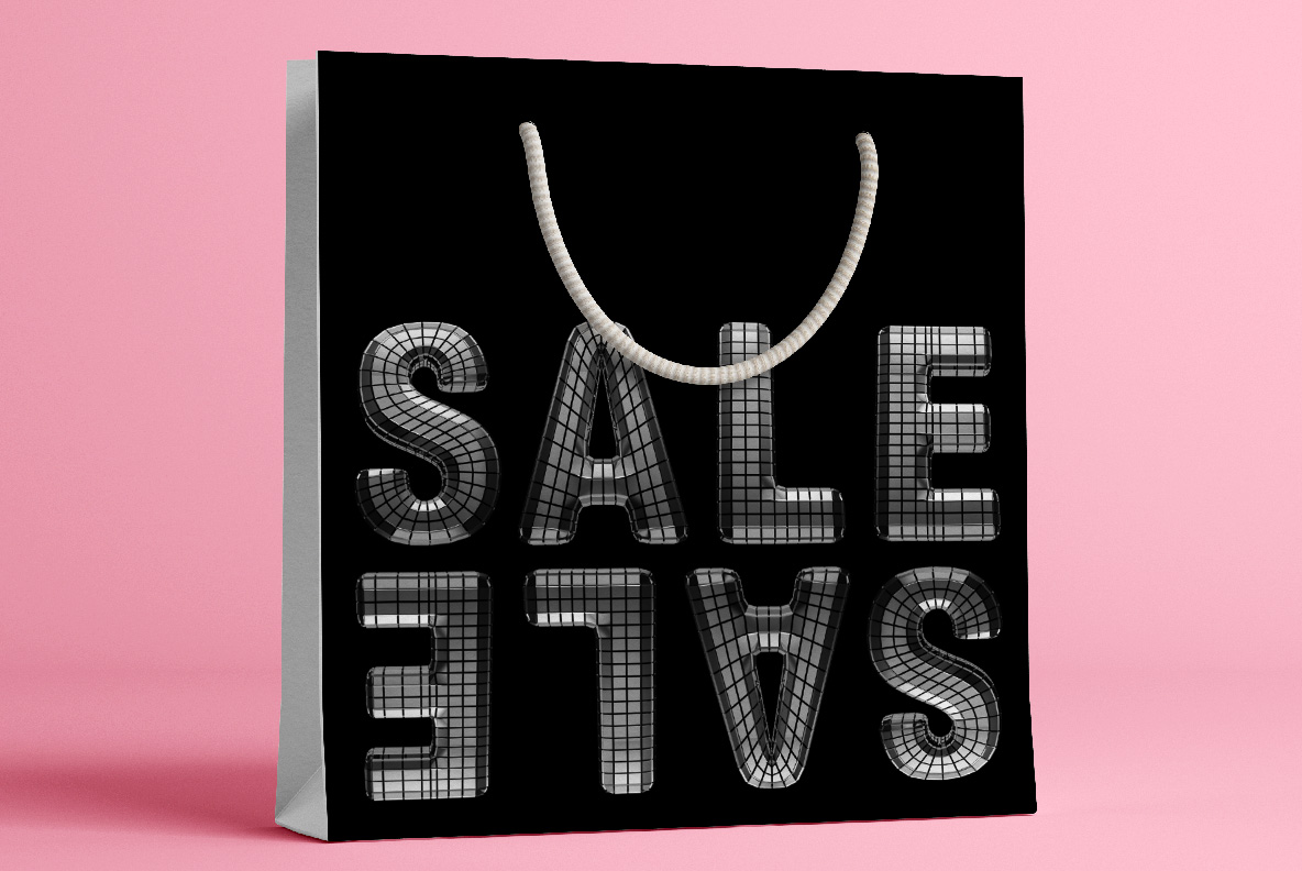 Black paper bag printed with the word sale in the Discoball Font