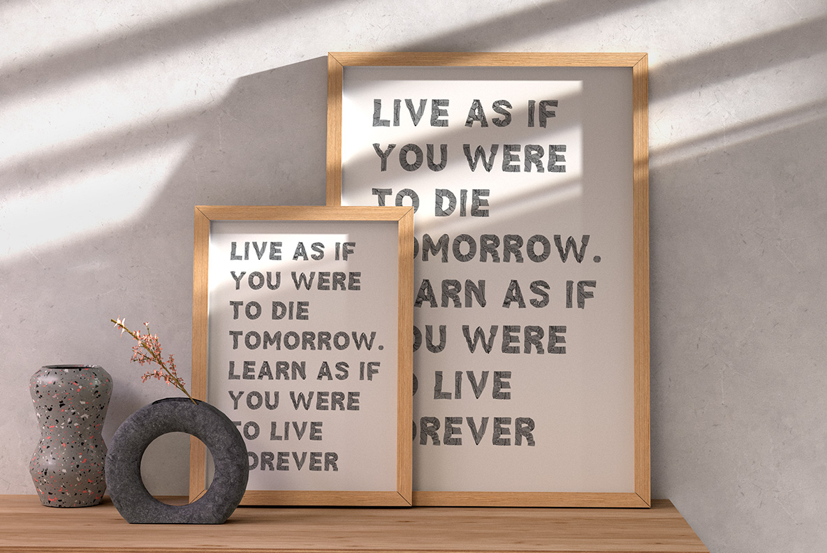 Framed prints on a shelf carrying a short saying set in the Duct Tape Font