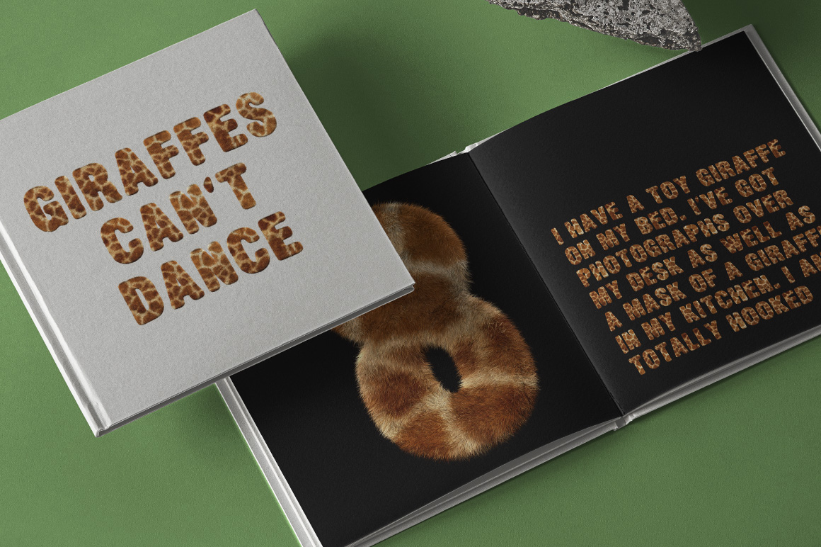 Giraffe Font – Giraffes Can’t Dance Open Book Mockup Giraffe Font open book mockup with Giraffes Can’t Dance lettering, a furry number 8 and a giraffe quote.
