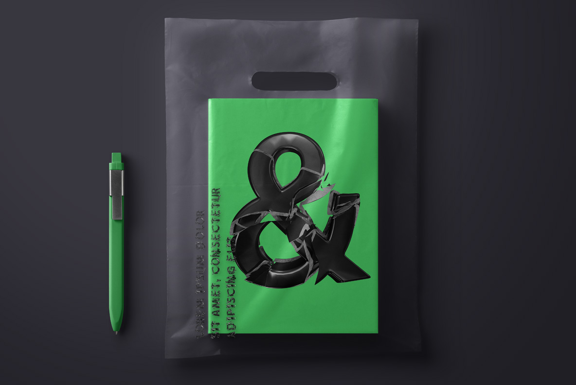 Green notebook mockup with a shattered black ampersand in A Broken Life Font