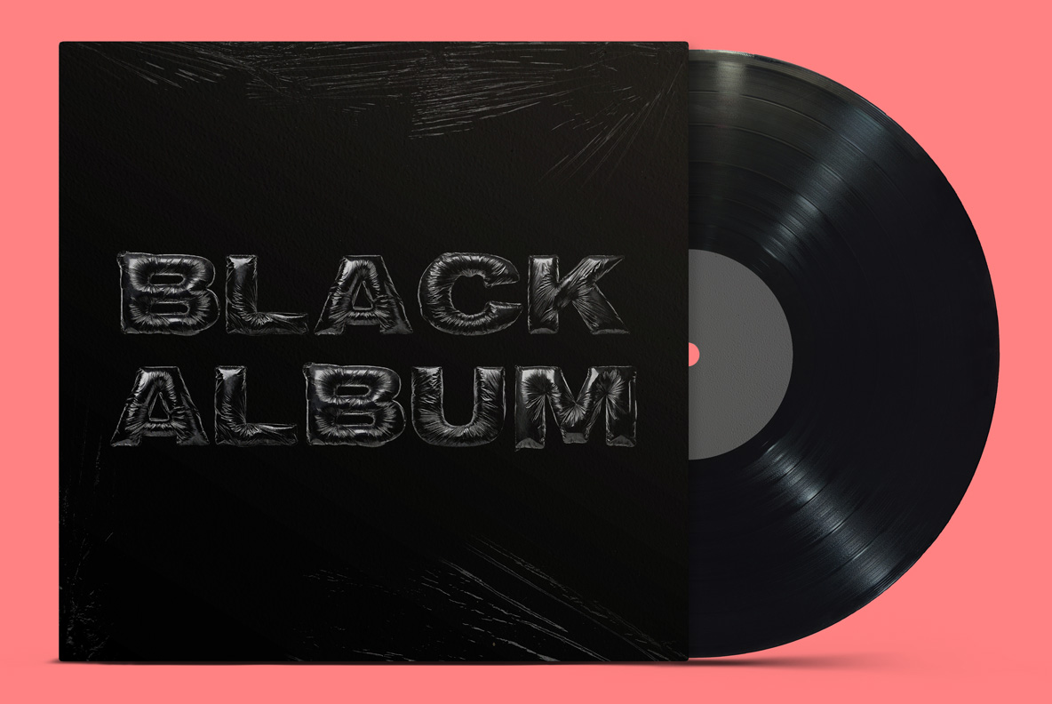 Black Album title in Black Bag Bold Font on a black record sleeve beside a vinyl disc, against a coral background.