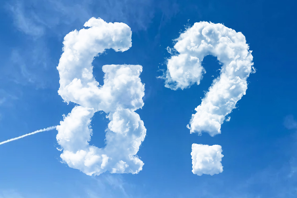 Puffy Clouds Font – Ampersand and Question Mark Puffy Clouds Font ampersand and question mark shaped from fluffy white clouds against a clear blue sky with a vapor trail.