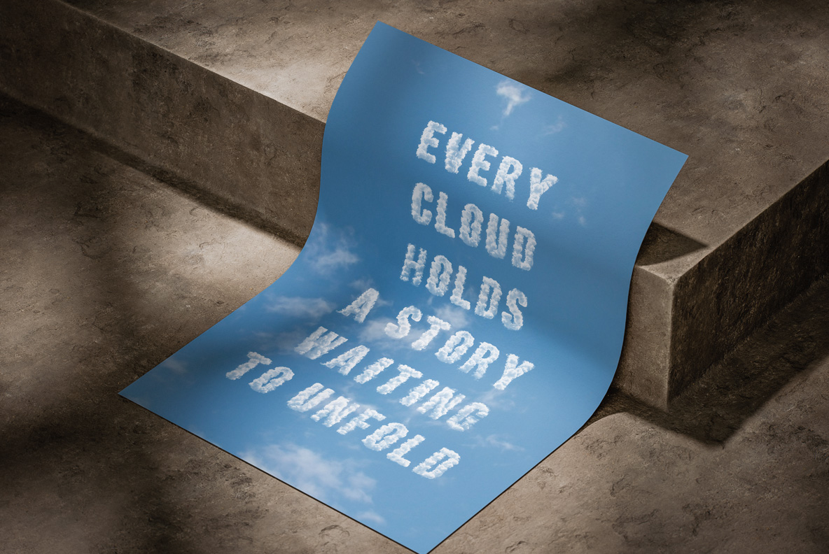 Puffy Clouds Font – Sky-Blue Poster Mockup Puffy Clouds Font used for a short line of white cloud letters on a curled sky-blue poster.