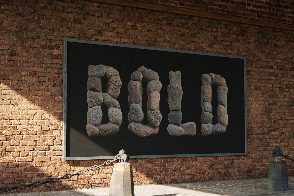 Stone Stack Font Billboard Mockup Black billboard on a brick wall spelling BOLD in the Stone Stack Font