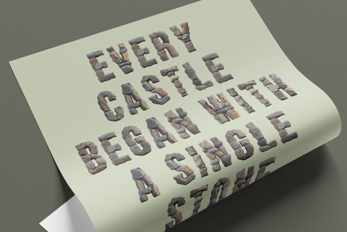 Stone Stack Font Paper Poster Mockup Curled paper poster with a four-line stone saying set in the Stone Stack Font