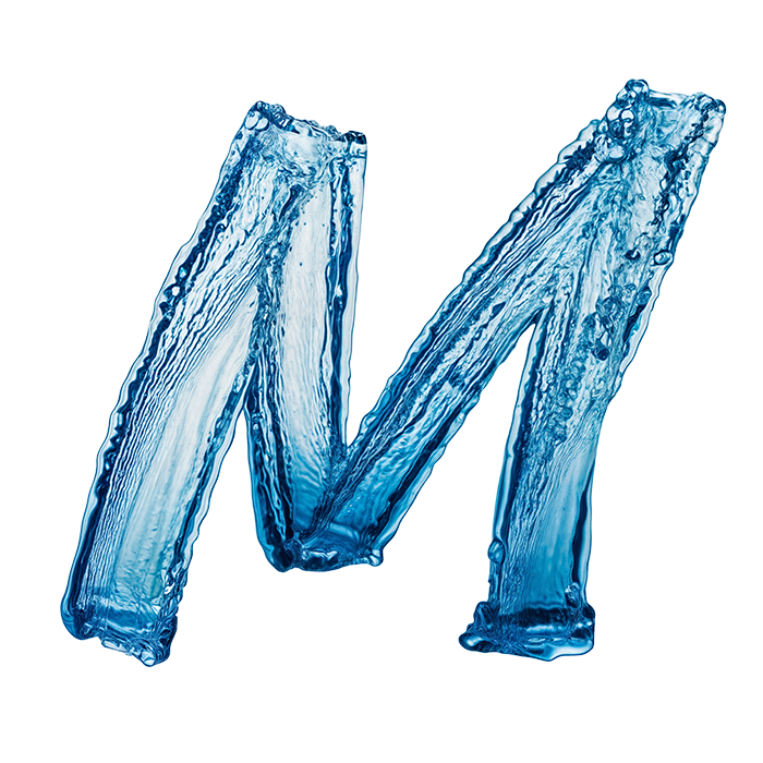 Capital M of the Dripline Font painted in streaky translucent water